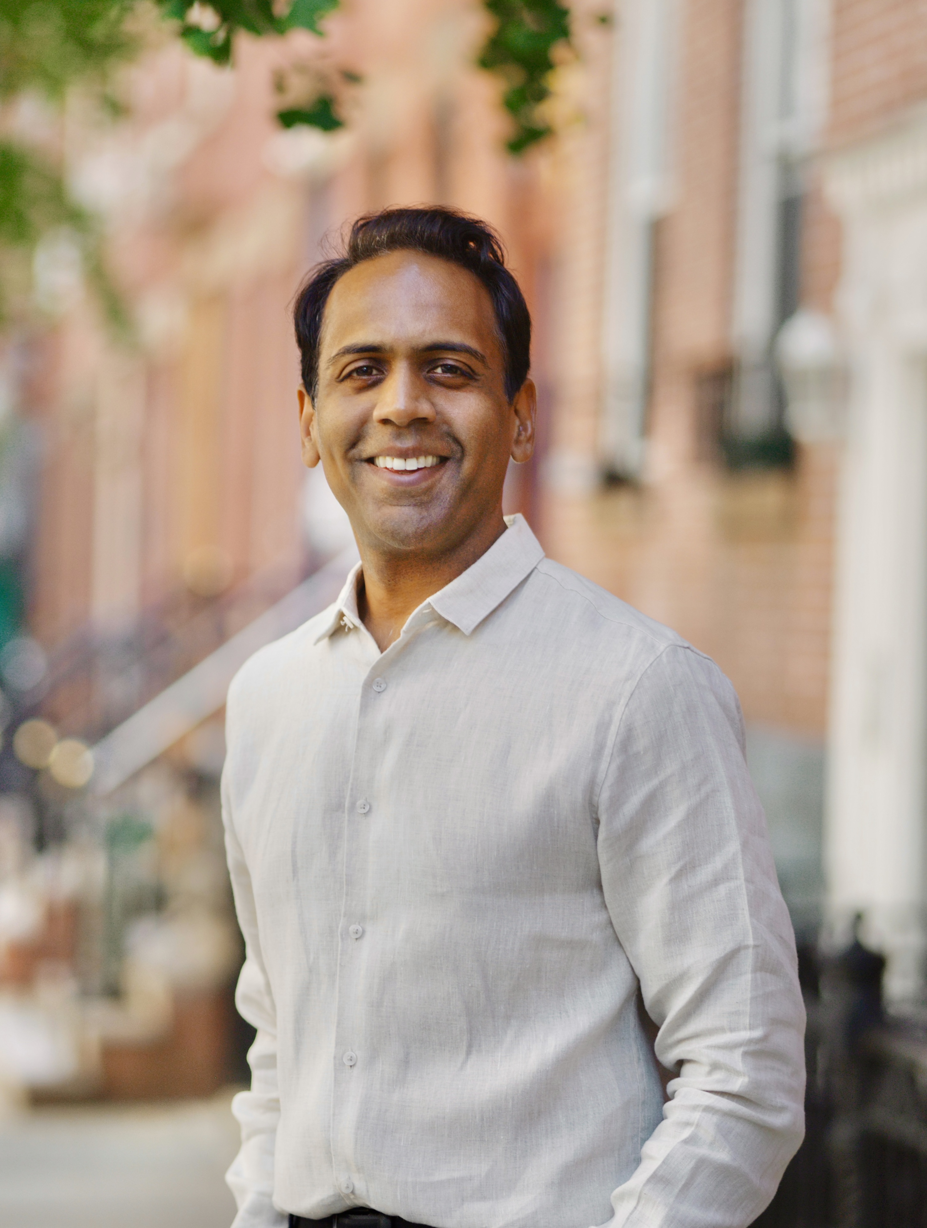 Raj Goyle smiling on a New York City street